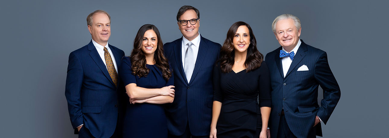 Photo of attorneys at Ottenwess Law